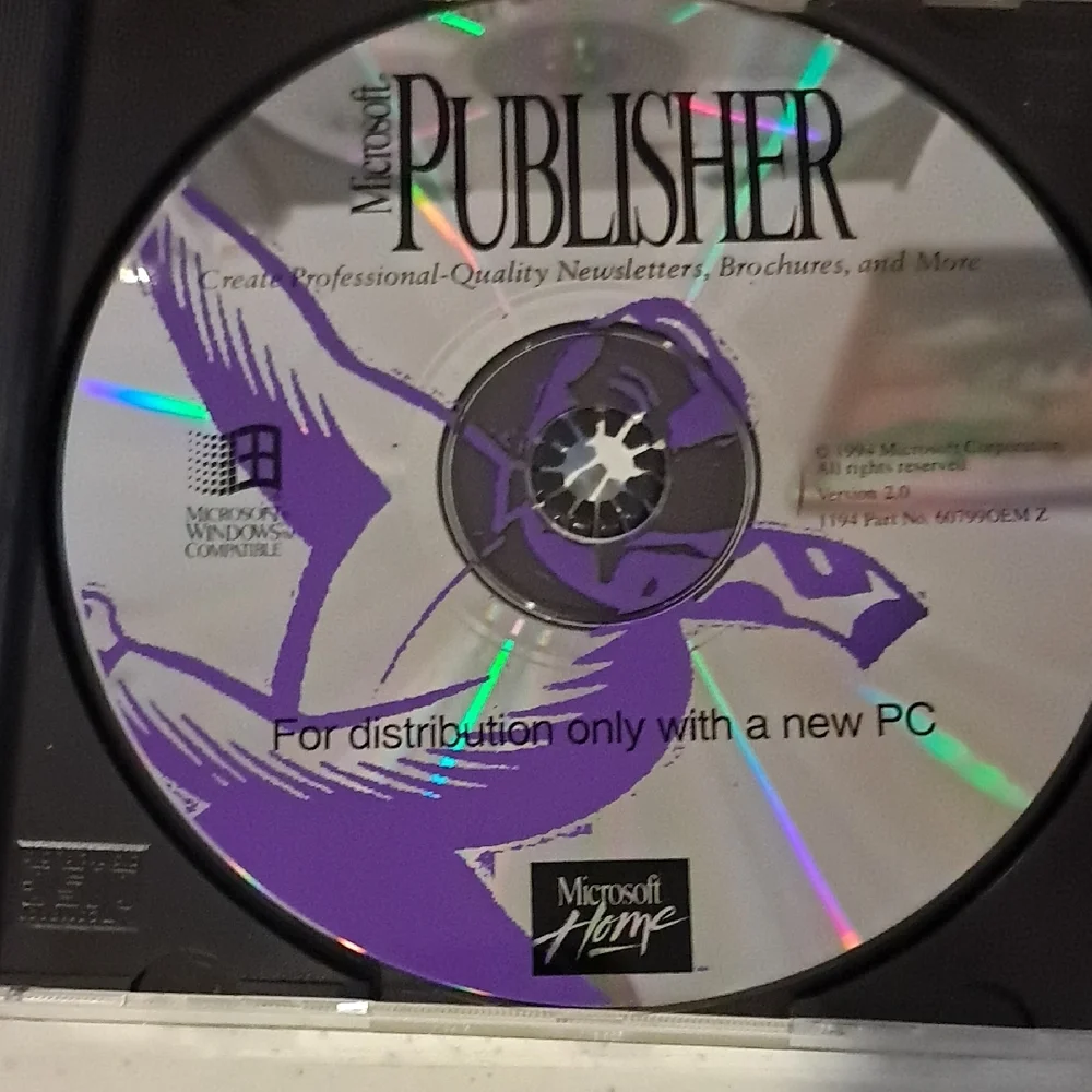 Microsoft Windows 95 and Office CD Set - Silver, Black, and Blue